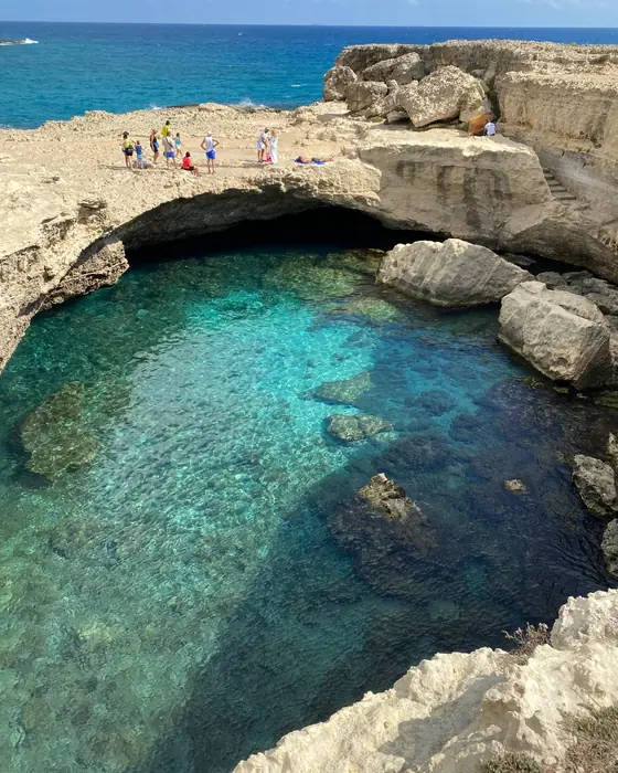 The turquoise natural pool of Grotta della Poesia on the Salento coast